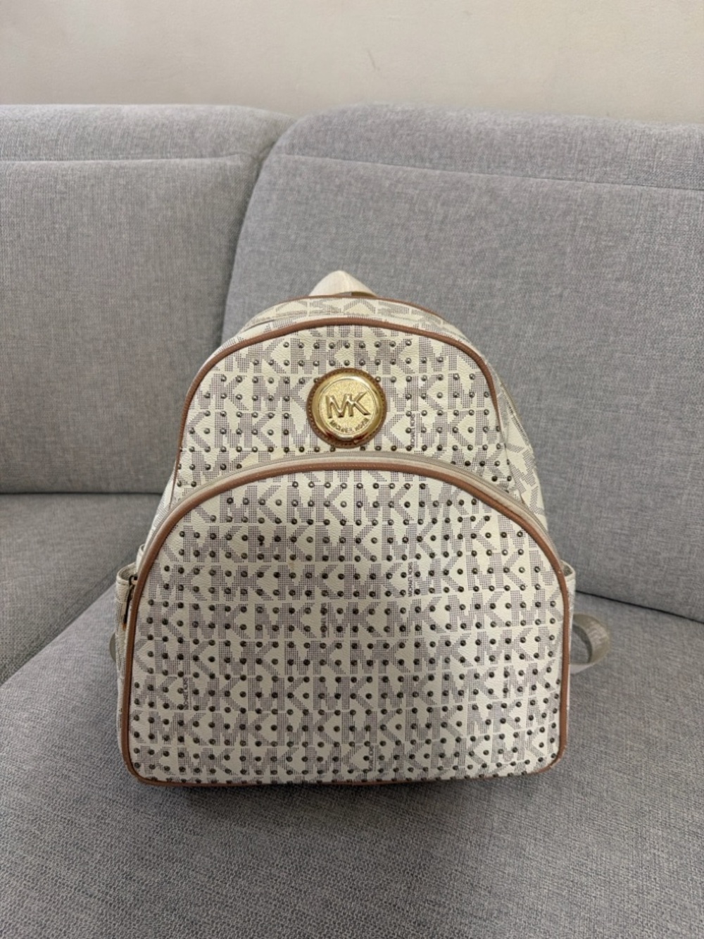 Michael Kors Cream Logo Backpack with Brown Trim and Gold MK Medallion